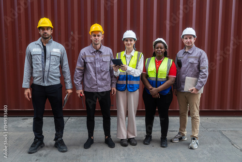 Diverse engineers discussing project on construction site