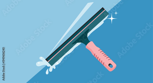 Flat lay of a pink-handled squeegee with soap suds on a blue background