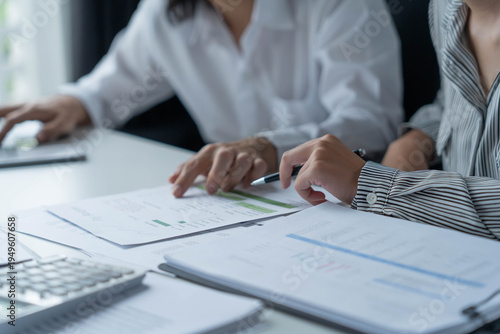 Businessman and businesswoman working together in an office