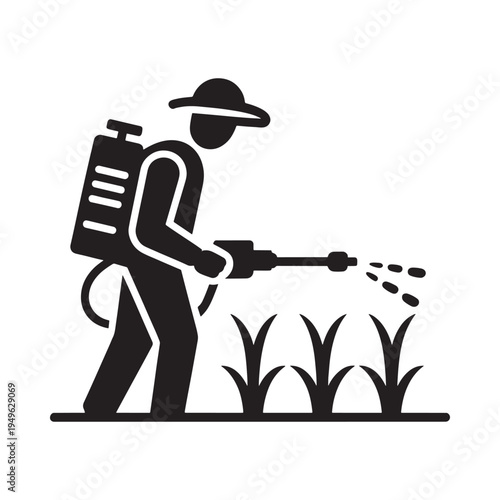 Worker spraying crops with a backpack mounted pesticide applicator