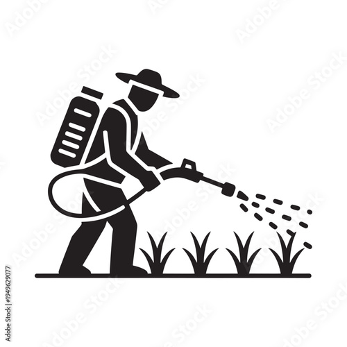 Farmer spraying crops with a backpack sprayer in a field