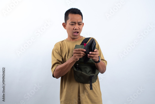 Man Looking Inside Wallet with Expressive Face