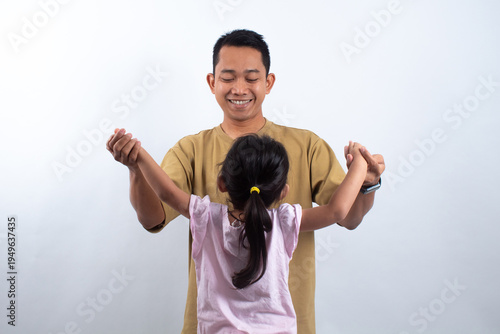 Father and Daughter Holding Hands on White Background