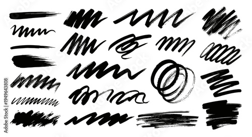 Collection of various black ink brush strokes and scribbles.