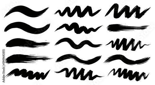 Collection of various black ink brush strokes and wavy lines.