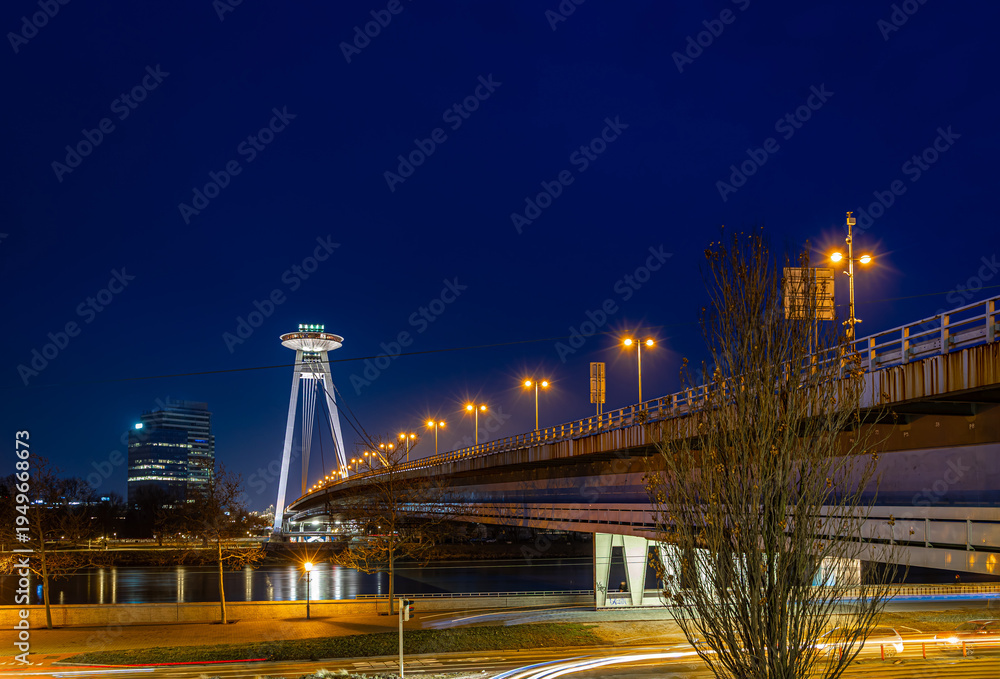 Fototapeta premium UFO Bridge Bratislava at night with illuminated tower and blue hour view