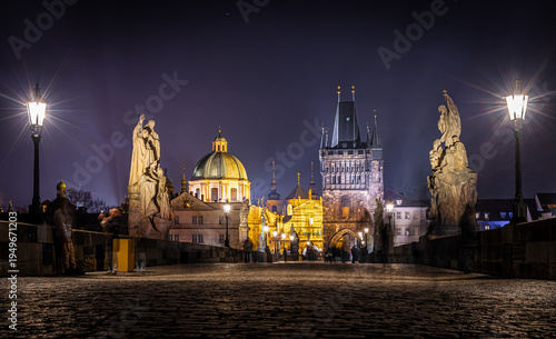 Photography Charles Bridge statues at night with Prague Castle skyline, Czech Republic