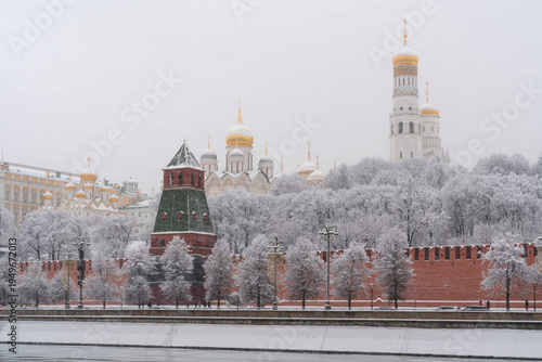 Architectural ensemble of the Moscow Kremlin from the embankment of the Moskva River during heavy snowfall, Moscow, Russia