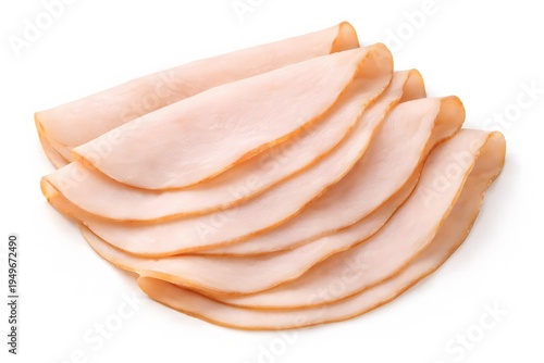 Slices of smoked turkey breast meat arranged in fan shape isolated on white background image