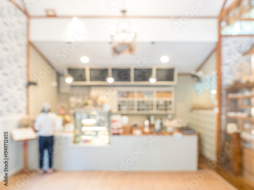 Blurred cafe and bakery interior background with warm lighting and clean modern design, creating soft bokeh atmosphere ideal for coffee shop promotion, lifestyle branding, and cozy workspace concept.