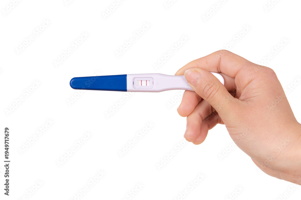 Obraz premium Hand holding pregnancy test showing positive result