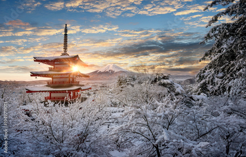 Fujiyoshida, Japan Beautiful view of mountain Fuji and Chureito pagoda at sunrise of Mount Fuji during winter.This is one of the famous spot to take pictures of Mount Fuji.