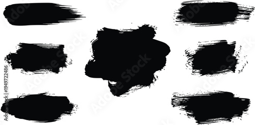 A collection of seven black ink brushstrokes on a white background