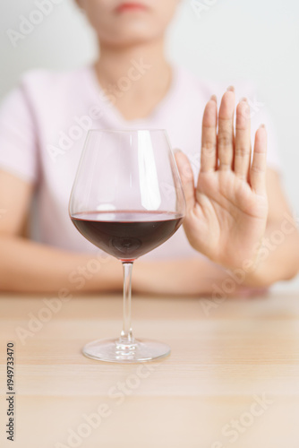 Fotografi woman making stop hand gesture to refuse a glass of Wine, Healthy man say no to alcohol drink, stop alcoholism and addiction concept