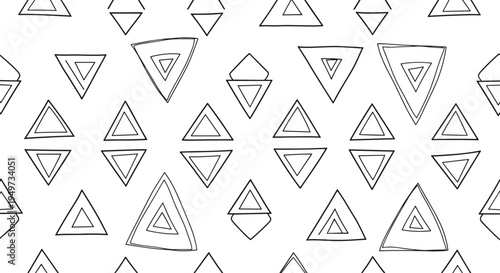 Minimalist seamless pattern of hand-drawn black and white geometric triangles of different sizes and orientations for backgrounds.