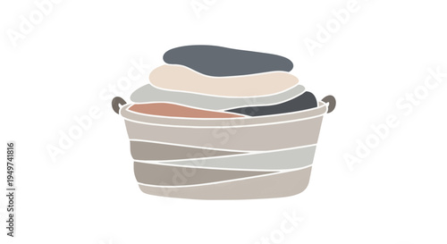 A laundry basket filled with clothes neatly folded and ready for washing or storage