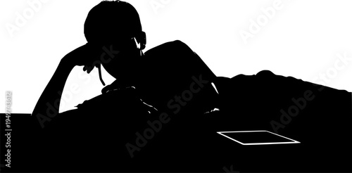 Black silhouette of boy lying with phone. Teenager resting on sofa. Young man watching mobile. Guy with tablet on bed