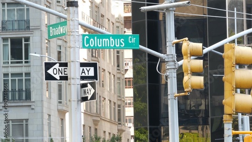 New York City Broadway street sign on Manhattan, United States. Urban road sign in american city. Traffic sign in Midtown of NYC USA. Traffic light near Columbus circle and Central Park. One way arrow