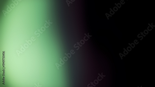 фотографія Soft green light leak creates ethereal glow on deep black background