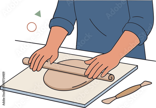 A person rolls dough with a rolling pin on a mat indoors.
