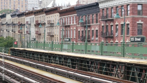 Photos New York City Upper Manhattan subway outdoor station platform, 125 street sign, elevated metro in Harlem, United States railway