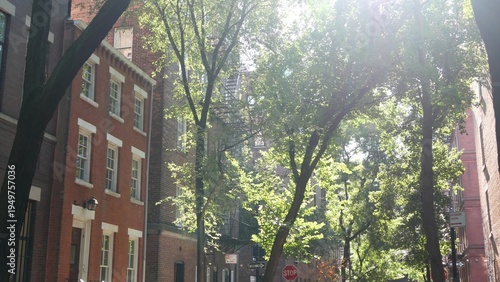 New York City urban residential buildings architecture, Manhattan classic street, Greenwich village, United States of America. Typical red brick house in NYC, real estate property in USA. West village
