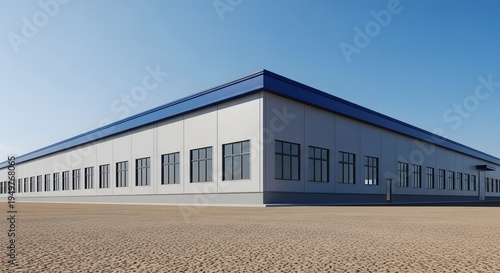 Modern Industrial Building Exterior for Commercial or Manufacturing Use with Blue Roof Against a Clear Sky 110 Chars