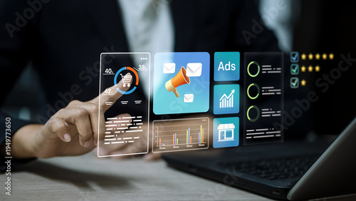 Person touching virtual marketing dashboard with advertising icons and data analytics graphs.