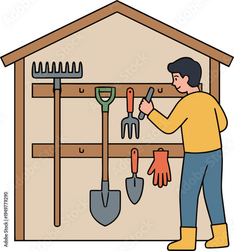 Man organizing gardening tools on a shed wall in a backyard