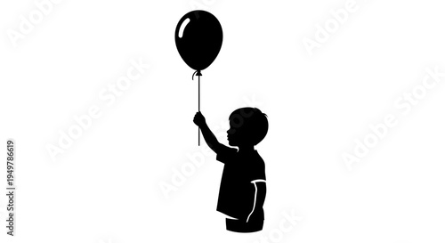 Silhouette of child holding balloon.