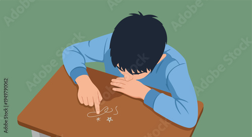 A child is doodling on a desk with their finger