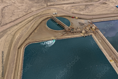 Aerial view of a mineral processing plant with thickener ponds and copper mineral separators