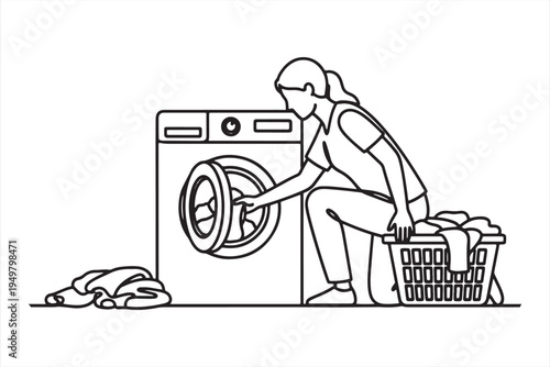 Woman loading washing machine with laundry