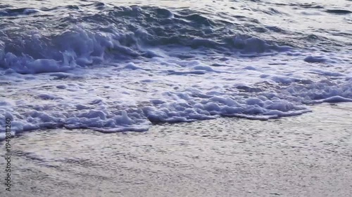 Close up shot of sea surf at beach