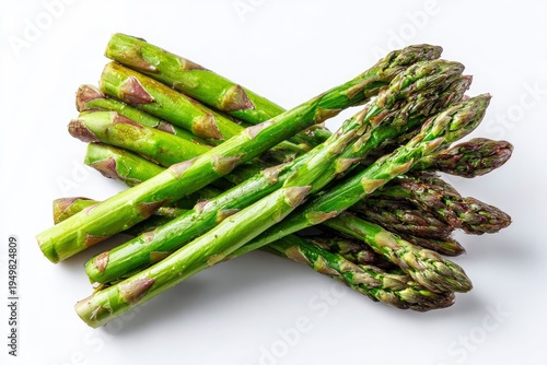 Fresh green asparagus spears on white.