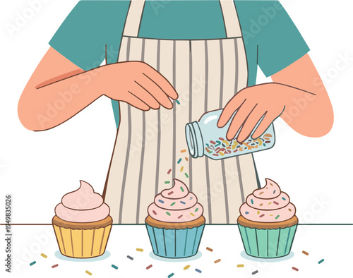A person in an apron sprinkles colorful sprinkles on cupcakes.