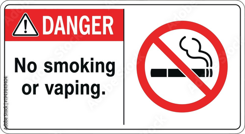 A warning sign displays a danger symbol and a no smoking or vaping sign indoors.