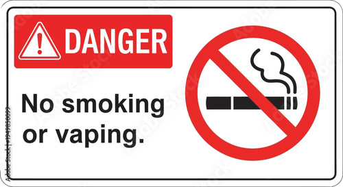 A warning sign displays a danger symbol and prohibits smoking or vaping.