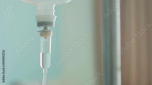 treatment for patient Close up of drops falling from saline liquid bag or IV bag is the infusion of liquid substances directly into a vein Close-up of