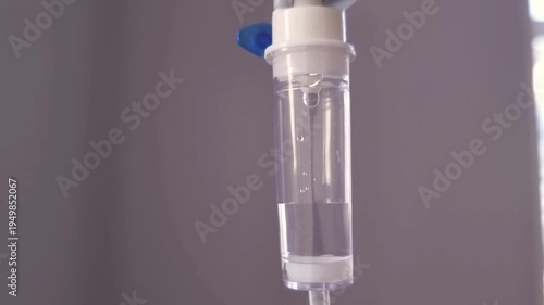 treatment for patient Close up of drops falling from saline liquid bag or IV bag is the infusion of liquid substances directly into a vein Close-up of