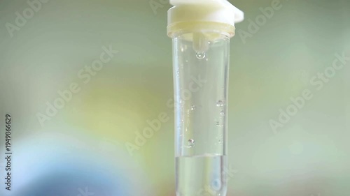 Slow Motion Set saline iv bag infusion dripping slowly A bottle of NaCI sodium chloride fluid setup for a patient's IV intravenous hydration drip In