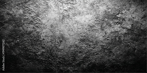 Dark black and white grunge background with a textured gray stone wall pattern and old dirty concrete material for a rough vintage surface backdrop