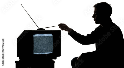 Man adjusting old television set.