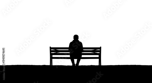 Person sitting on a bench alone.