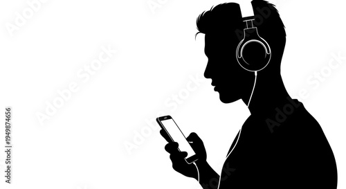 A silhouette of a man listening to music on his phone