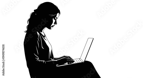 A woman works on her laptop in a dark room with focus