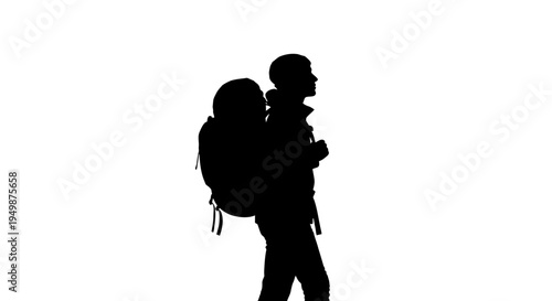 Silhouette of man carrying child backpack.