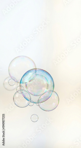Soap bubbles with floating soap bubbles on soft light background for spring freshness cleaning concept