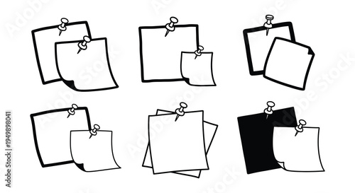 Collection of black and white note cards pinned to a surface