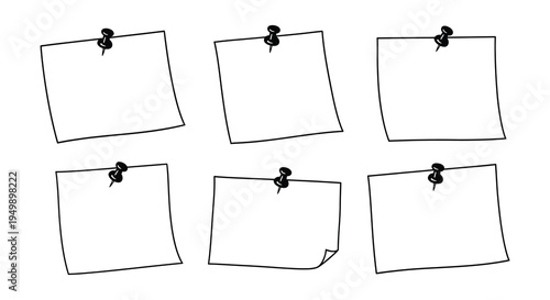 Collection of black and white note cards pinned to a surface